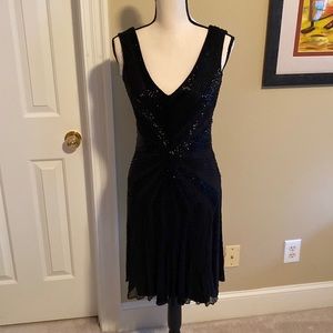 Vintage Black beaded cocktail dress. Size 8. Deep V in the back. Side zip. EUC